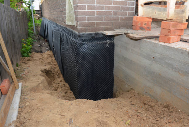 Happy homeowners after waterproofing job in Hopkins